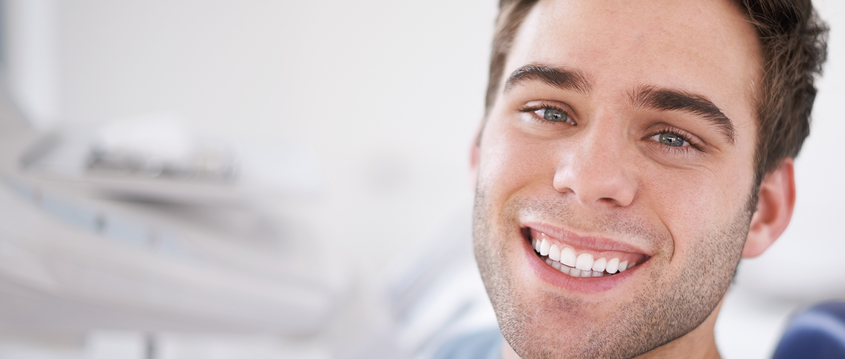 man at dentist smiling